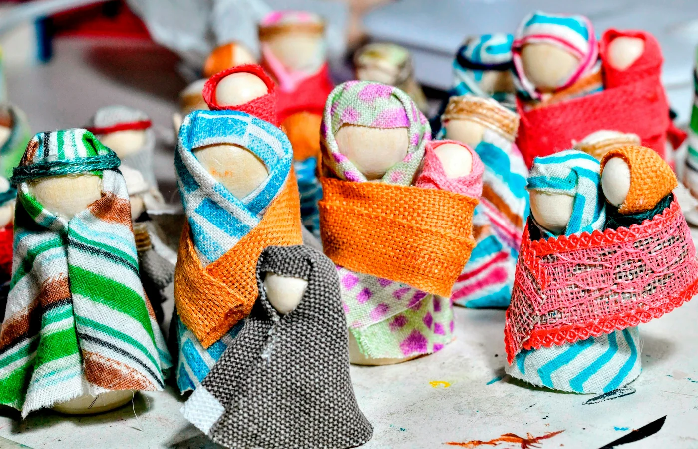 Small handmade cloth figures made from varied textiles.