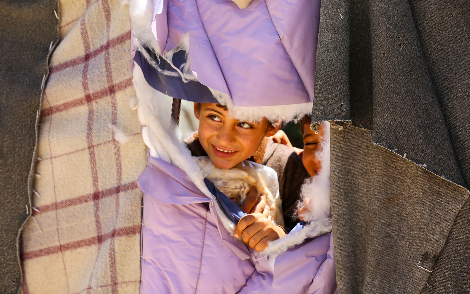 Close-up of a doll wearing a modified costume with a hidden pocket for an insulin pump, showing careful stitching and invisible closures.