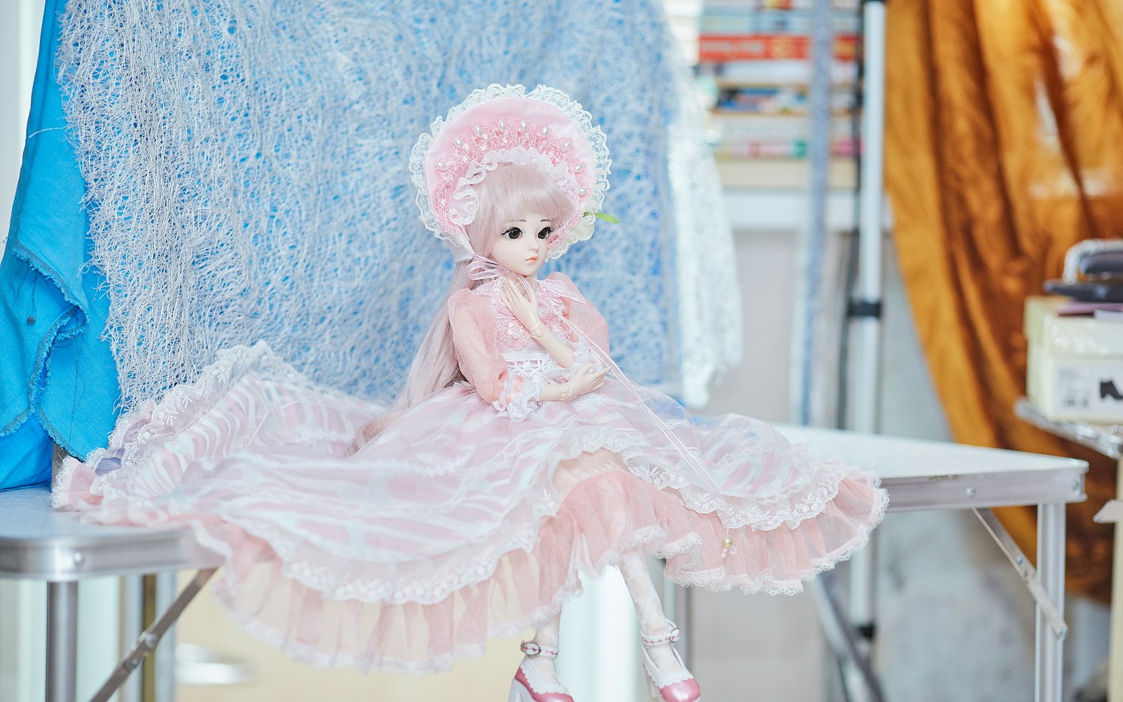 White muslin toile on a jointed doll with pinned adjustments at the waist and hip