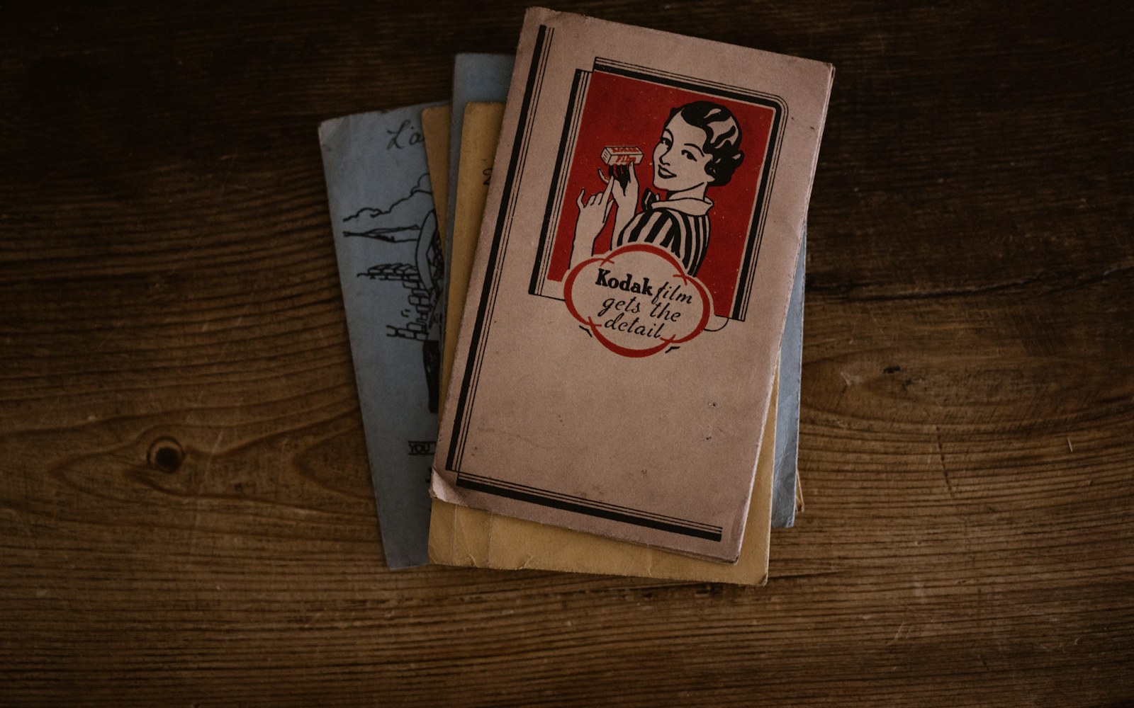 A handwritten collection record beside a handmade doll and a small dollhouse, photographed in soft natural light.