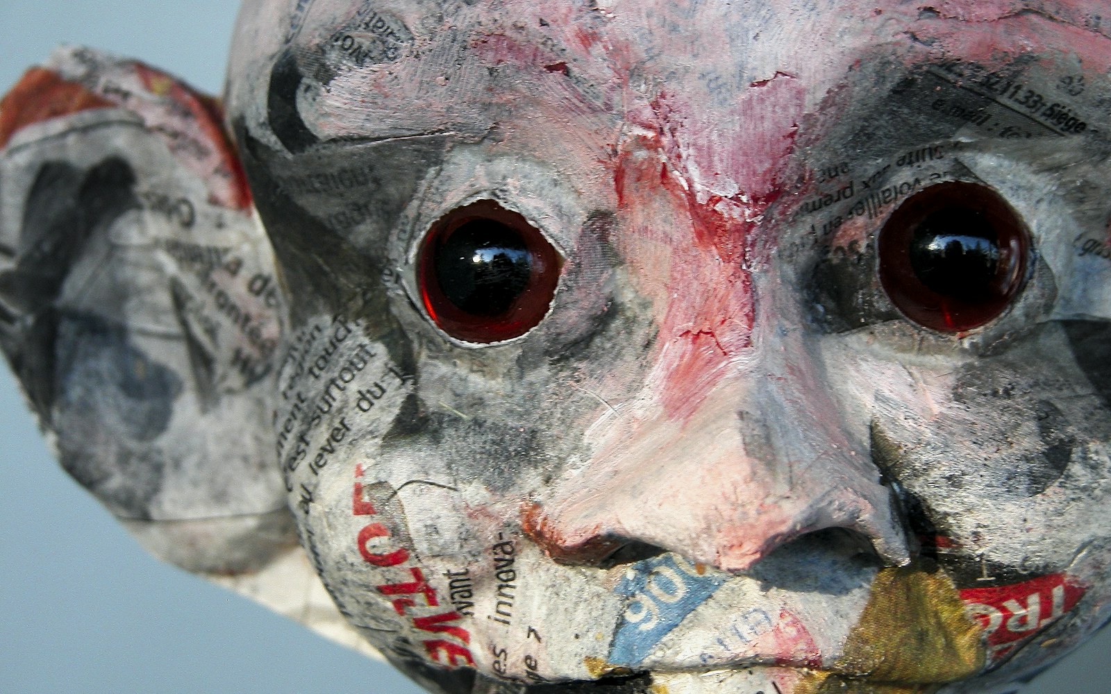 Side-by-side test patches of matte, satin, and gloss sealer on a painted doll face fragment