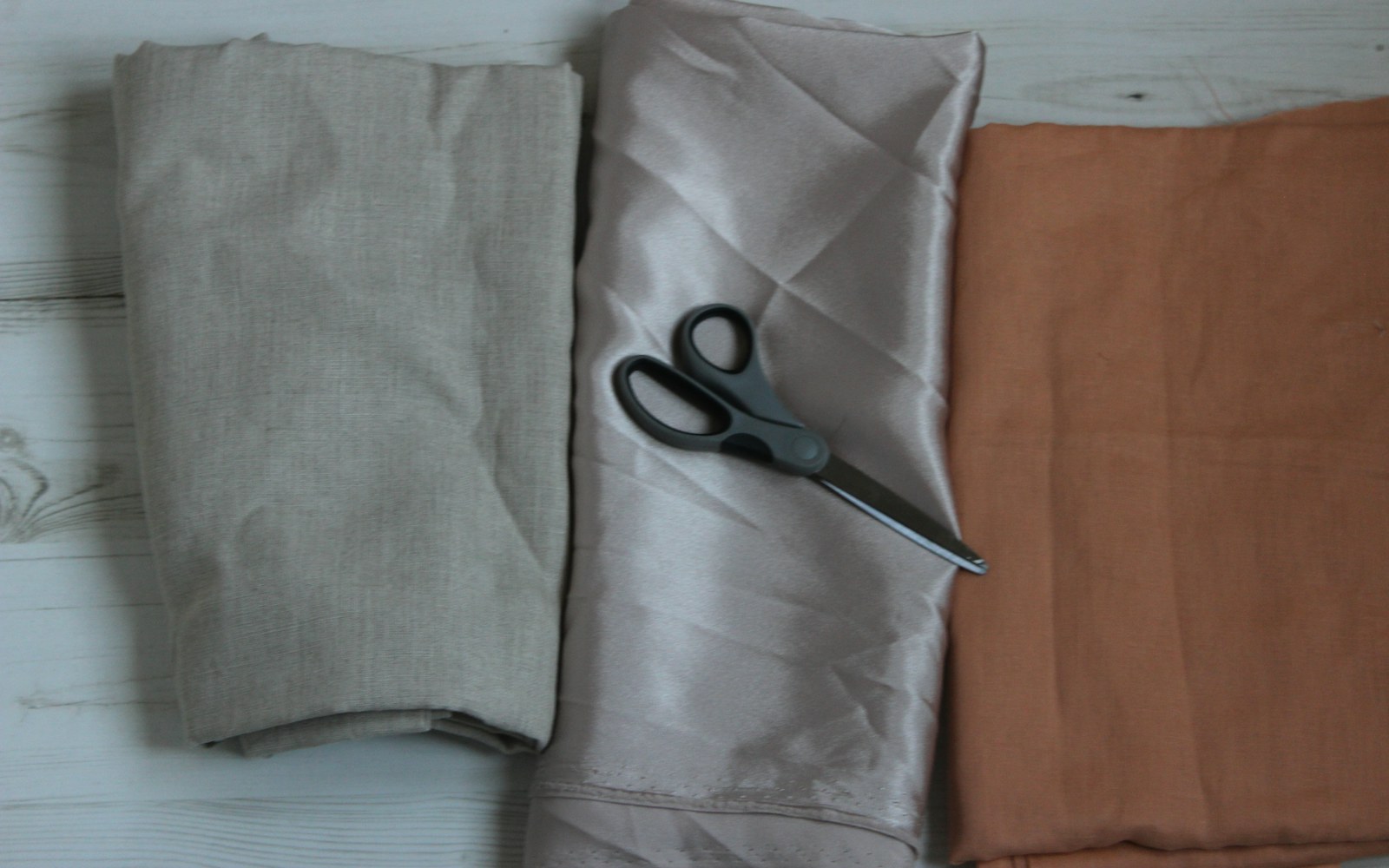 Close-up of a doll wearing a costume with a structured puffed sleeve, showing the seam and inner stiffening material